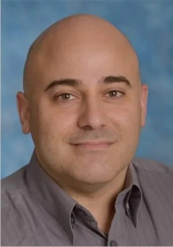 A headshot of Associate Professor Barak Aaronson