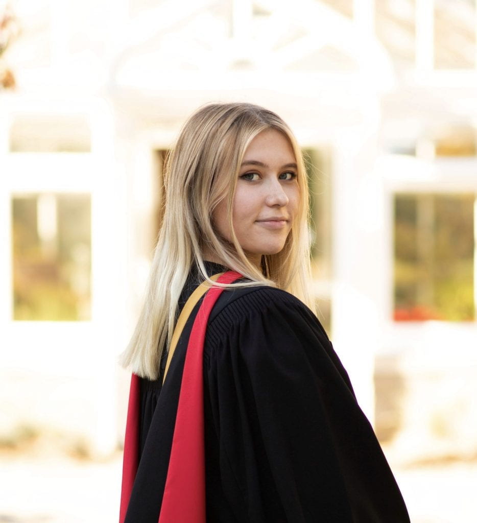 A photo of Emily Knapper in a graduation gown